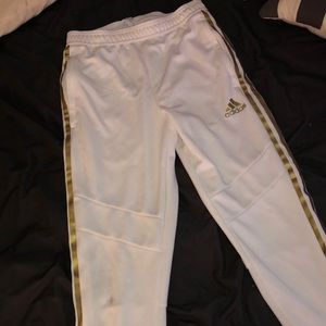 Small white and gold adidas pants